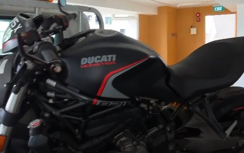 Ducati Monster secured on our tow truck in a Singapore carpark